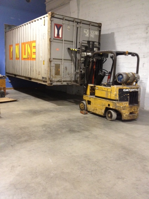 shipping container moving into the warehouse